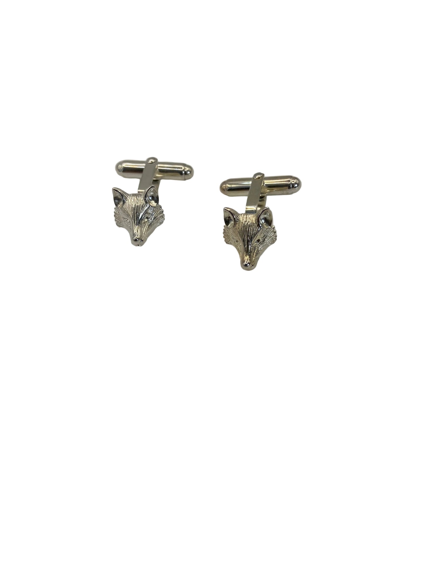 Pair of silver cufflinks on a light gray background